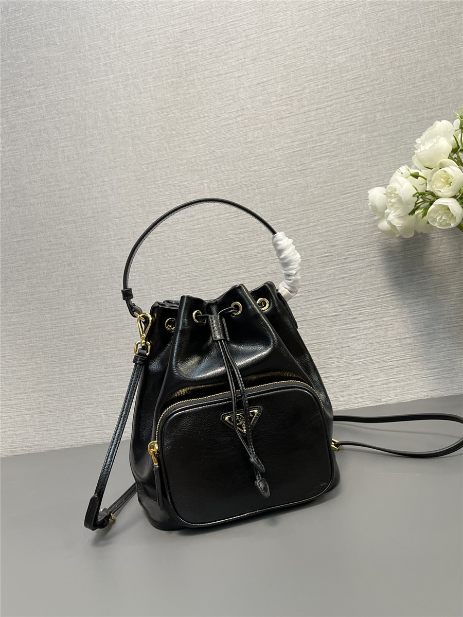 Pra*a black leather bucket crossbody bag