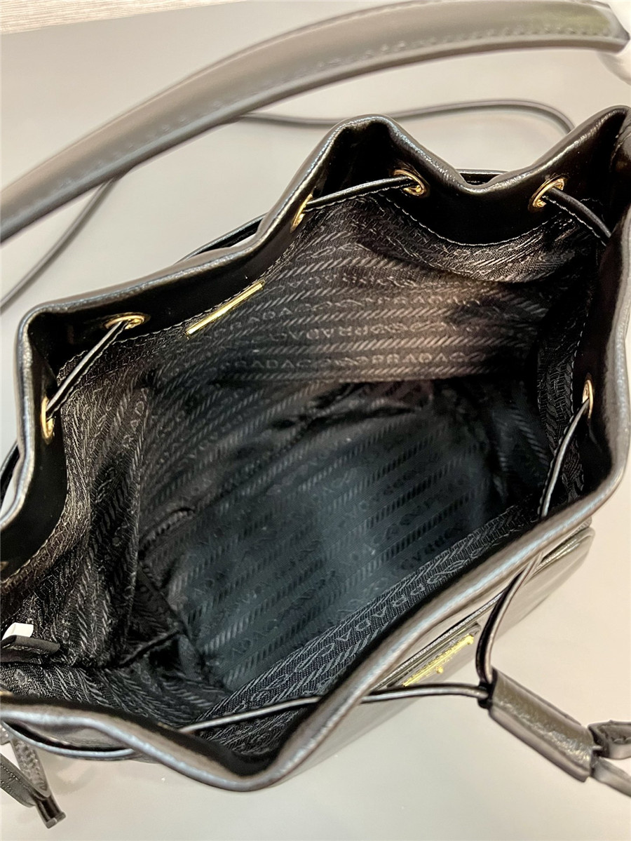 Pra*a black leather bucket crossbody bag