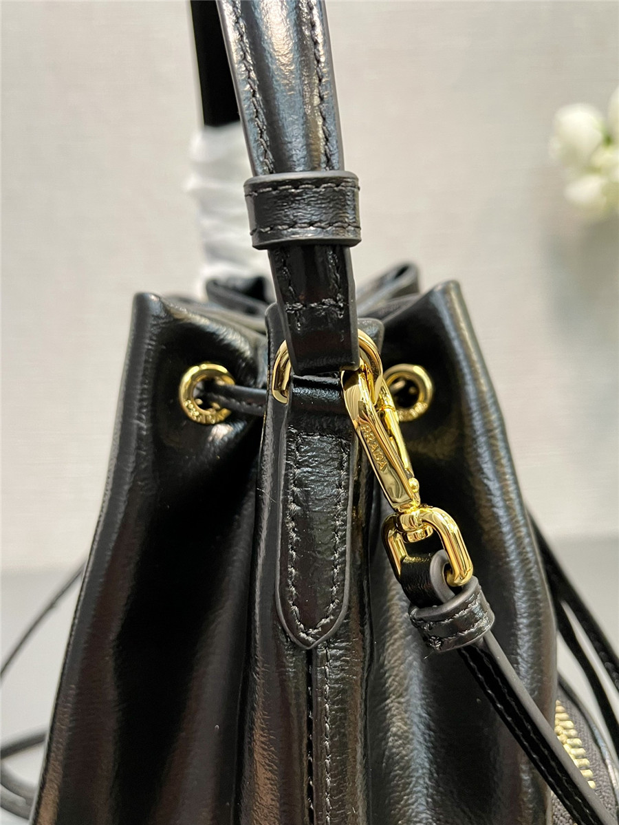 Pra*a black leather bucket crossbody bag
