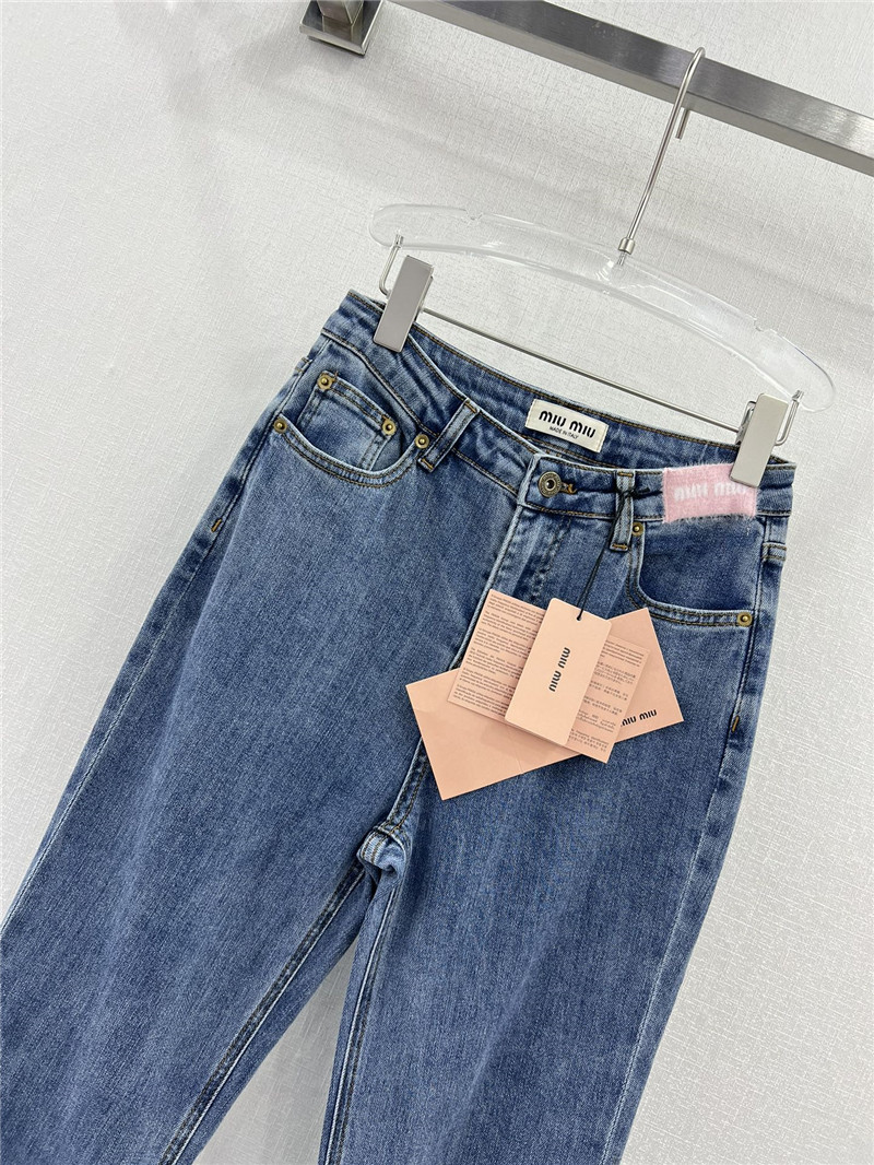 M1um1u waistband letter patch logo embellished jeans