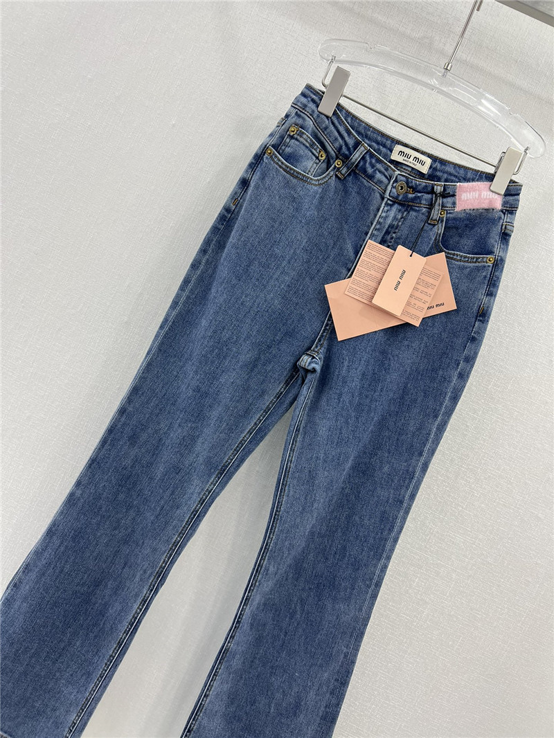 M1um1u waistband letter patch logo embellished jeans