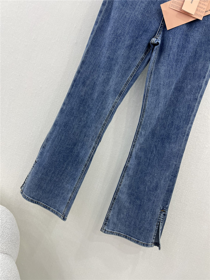 M1um1u waistband letter patch logo embellished jeans