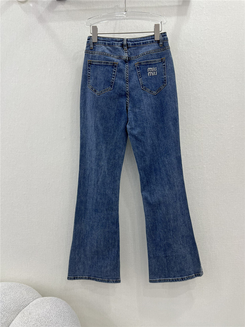 M1um1u waistband letter patch logo embellished jeans