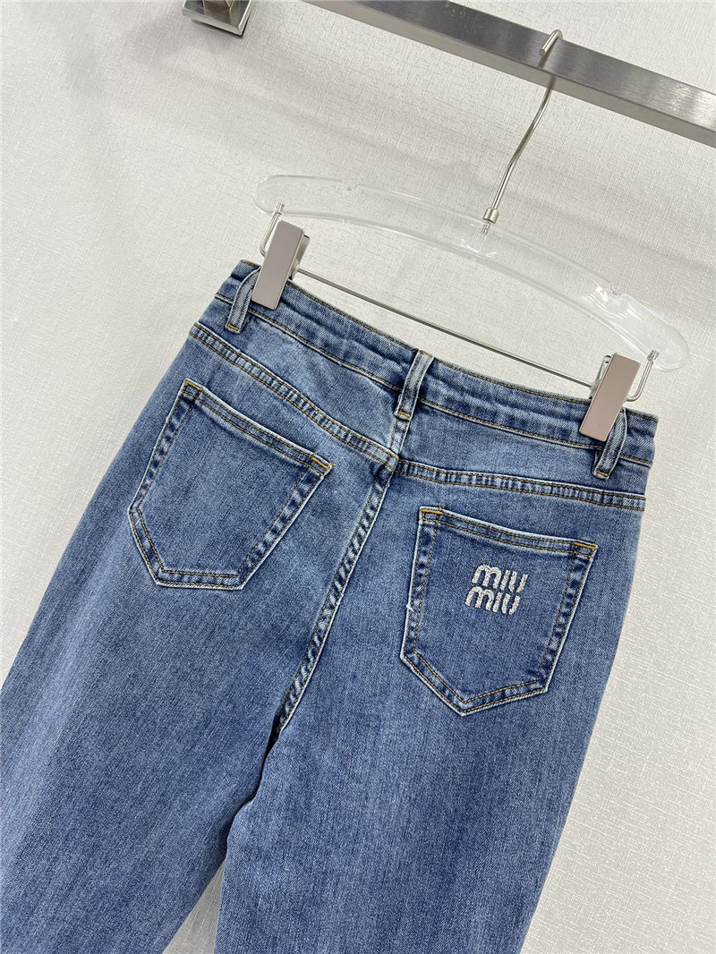 M1um1u waistband letter patch logo embellished jeans