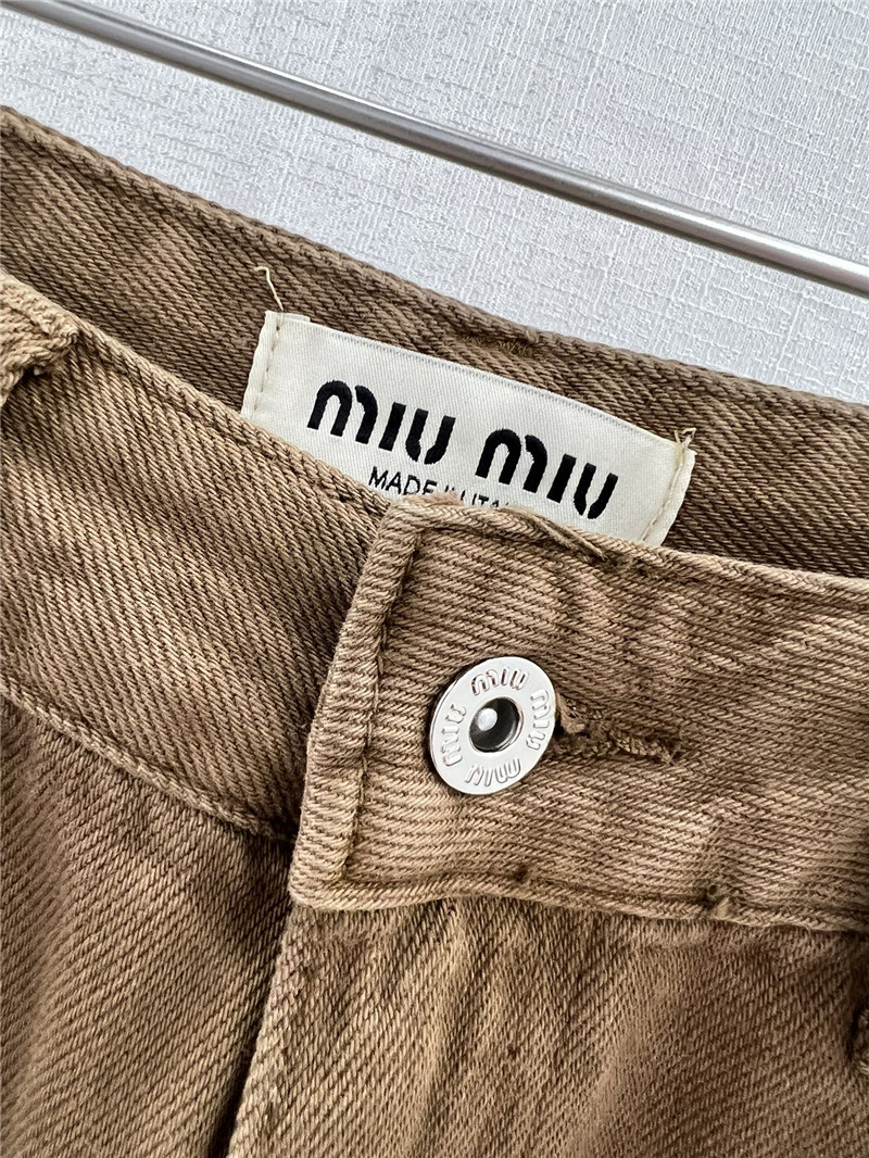 M1um1u waistband letter patch logo embellished jeans