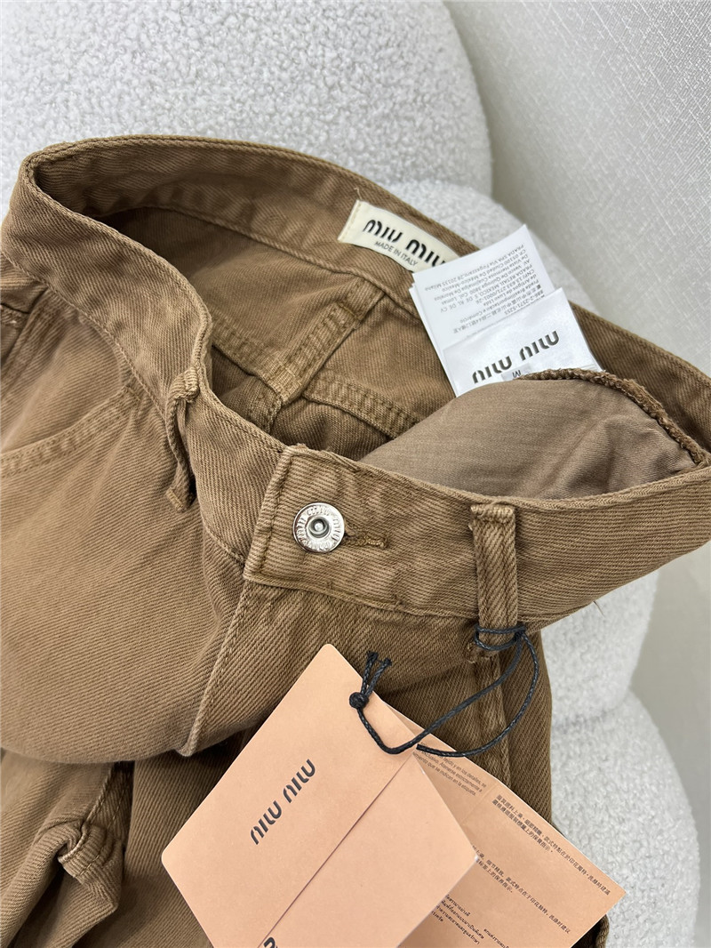 M1um1u waistband letter patch logo embellished jeans