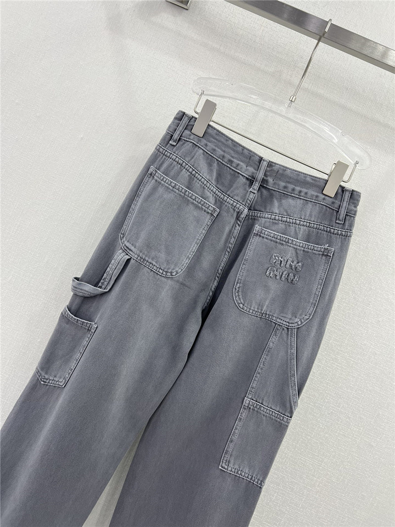 miumiu waistband letter patch logo embellished jeans