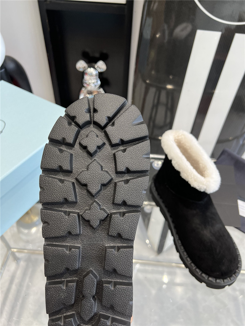 Pra*a triangle-logo suede boots in black