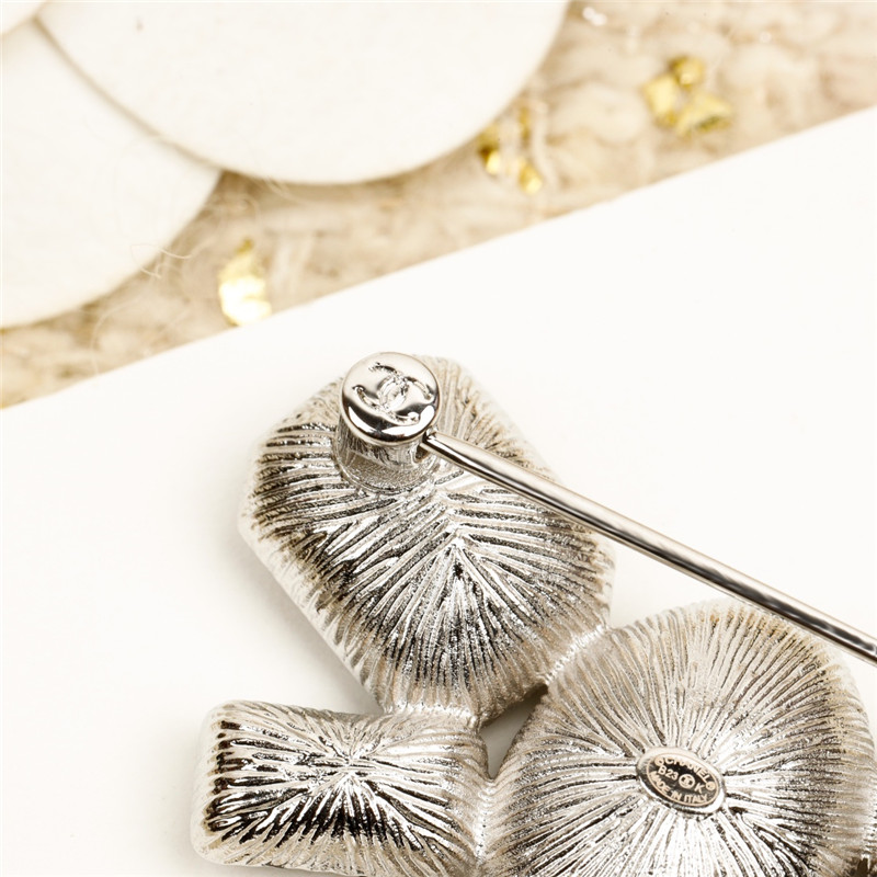 Ch**el bow double c brooch