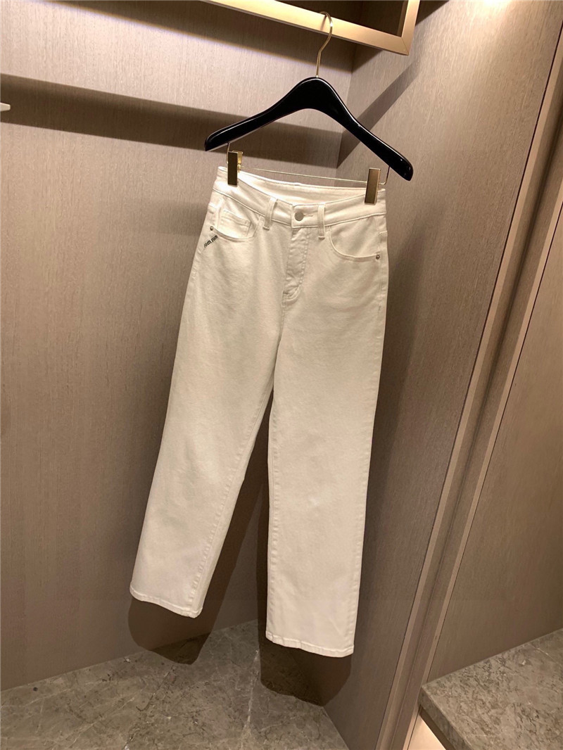 miumiu pocket embroidered lettering jeans