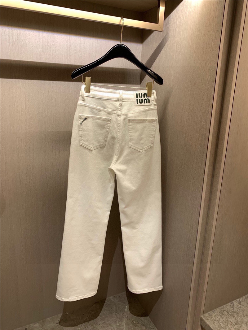 miumiu pocket embroidered lettering jeans