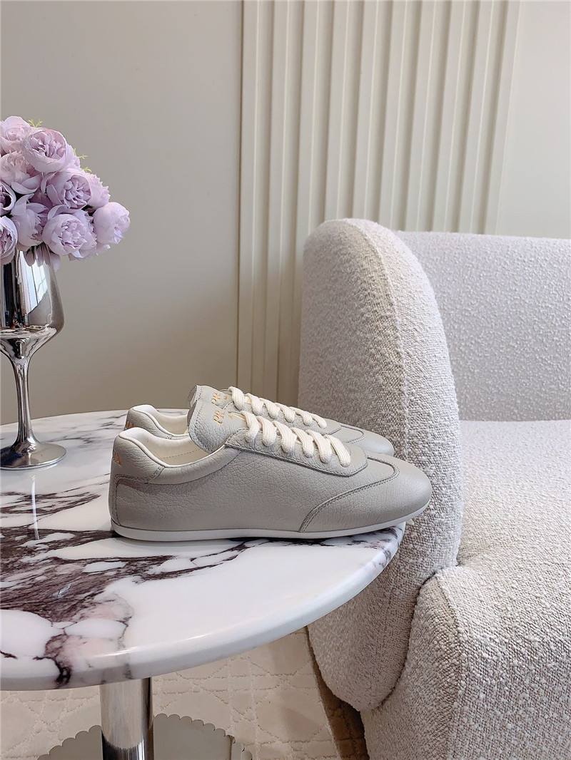 Pra*a triangle logo sneakers in gray