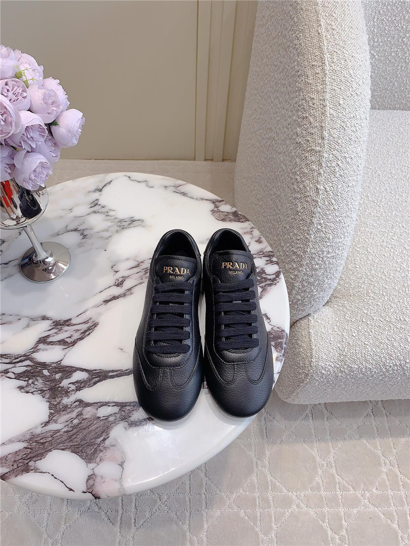 Pra*a triangle logo sneakers in black