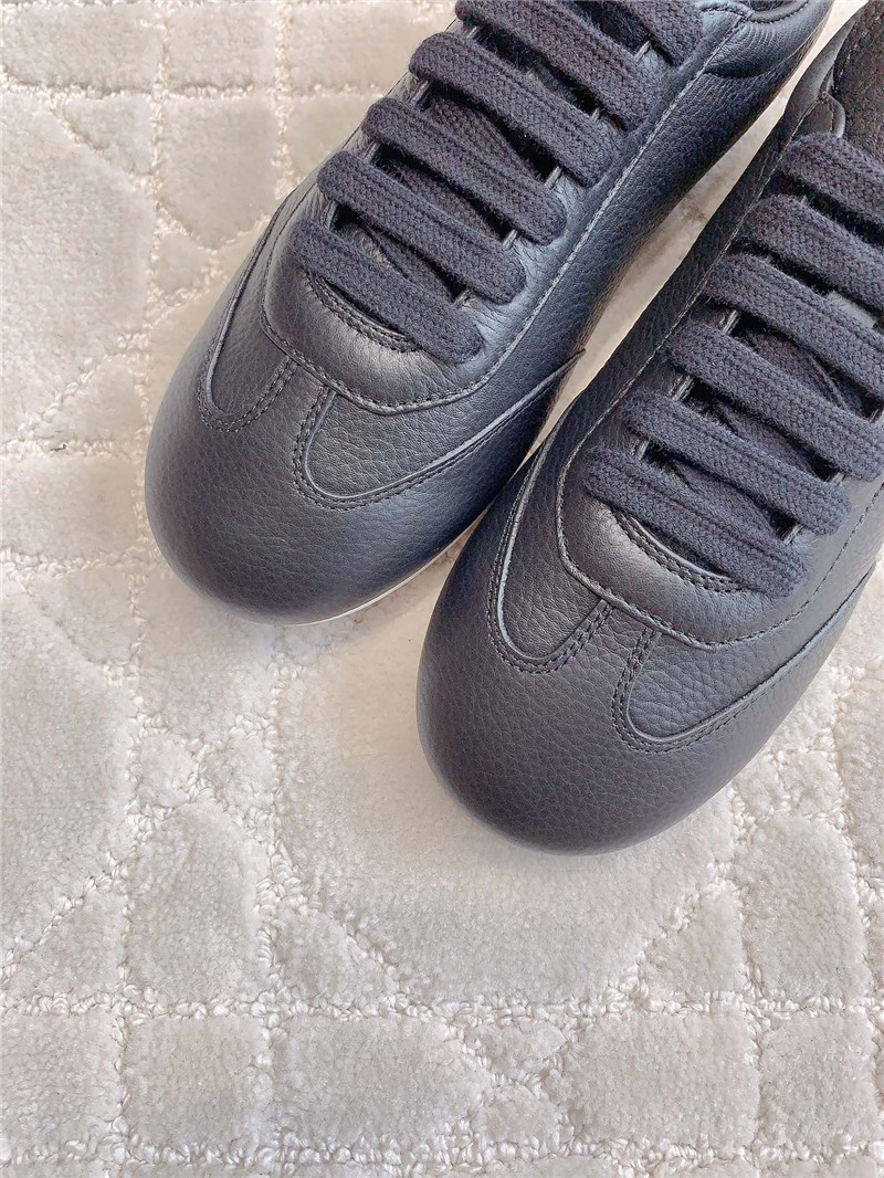 Pra*a triangle logo sneakers in black