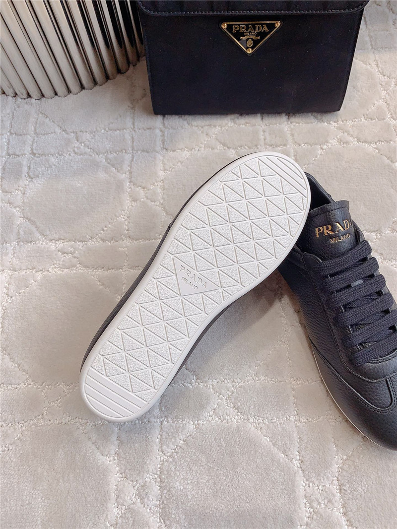 Pra*a triangle logo sneakers in black