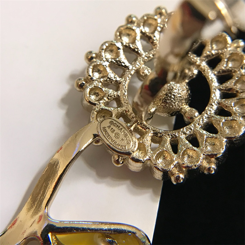Chanel sunflower flower pendant oil drop ear clip