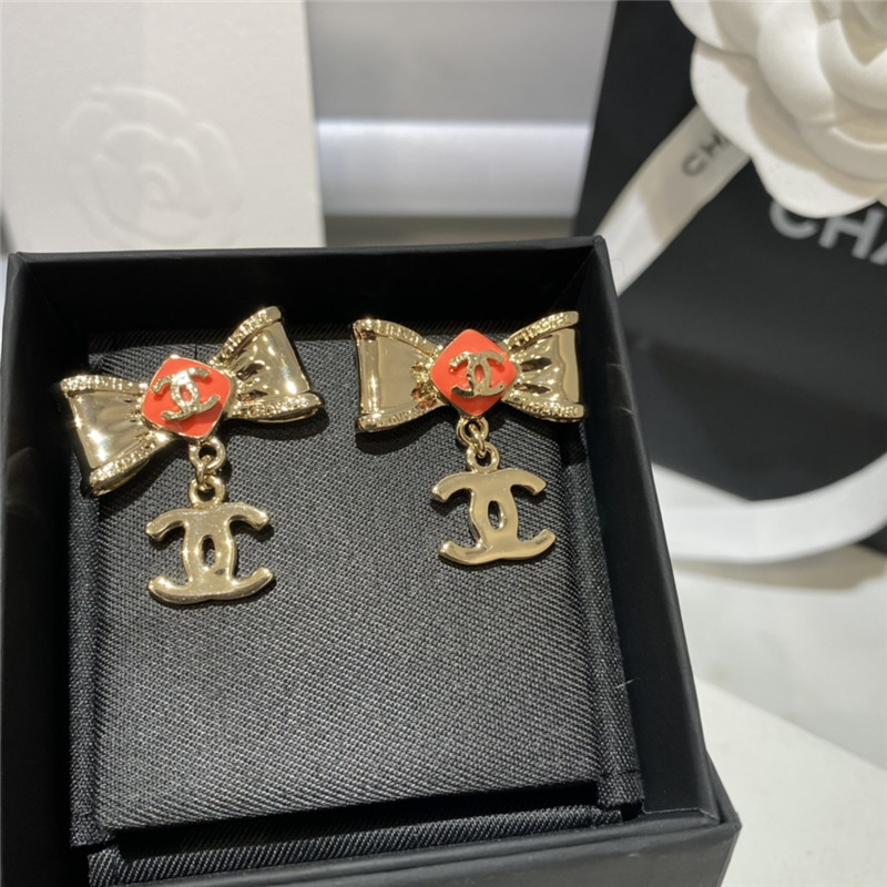 Ch**el orange bow engraved earrings