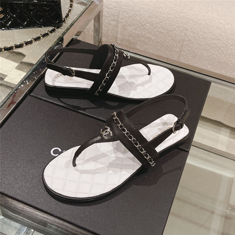 Ch**el quilted t-strap chain flat sandals black and white