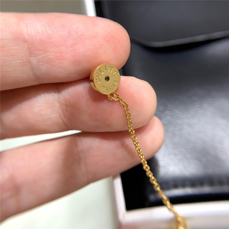 Ce1i*e double chain arc de triomphe hanging bead earrings