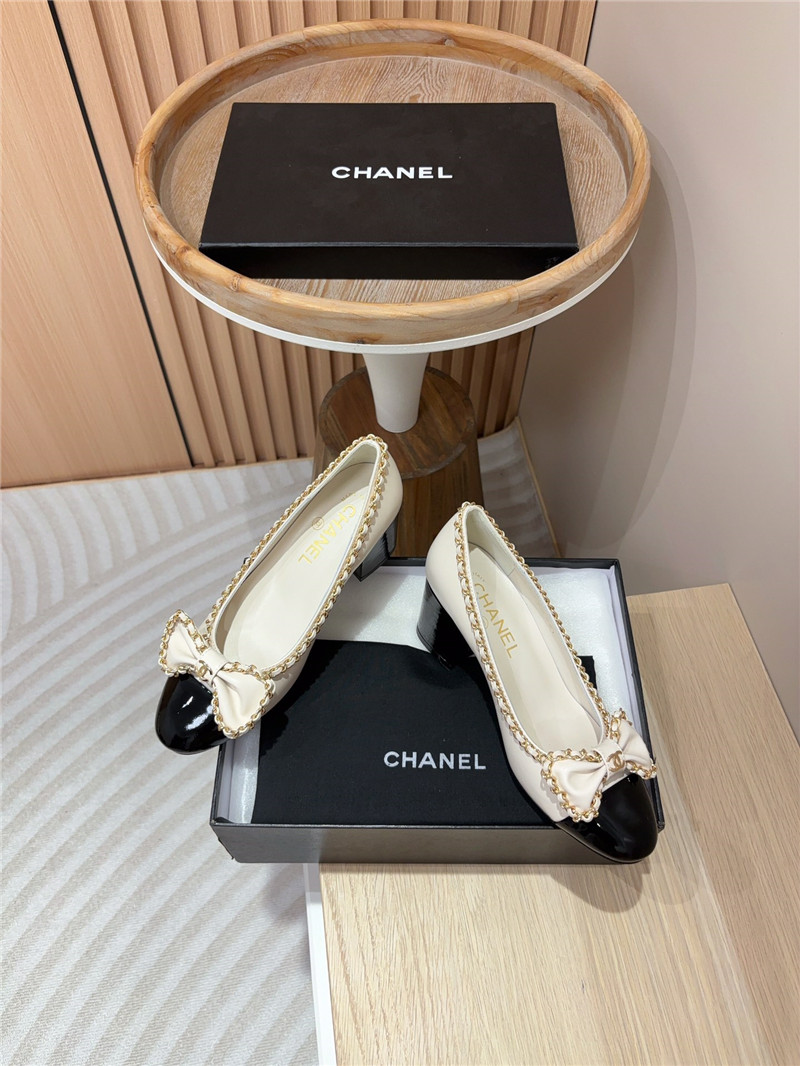 Ch**el bow chain trim ballet pumps in white and black leather
