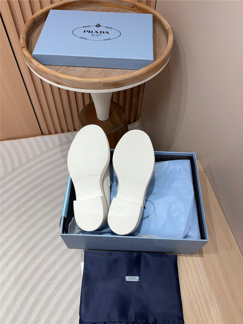 Pra*a white double chocolate leather loafers