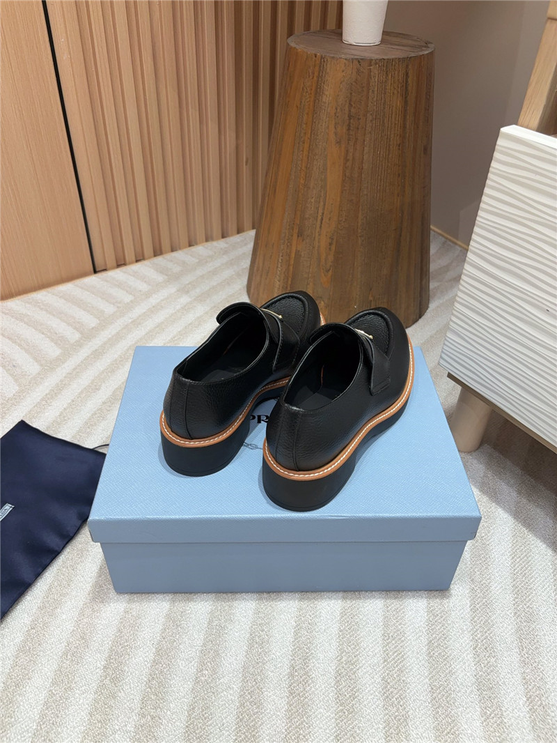 Pra*a black double chocolate leather loafers