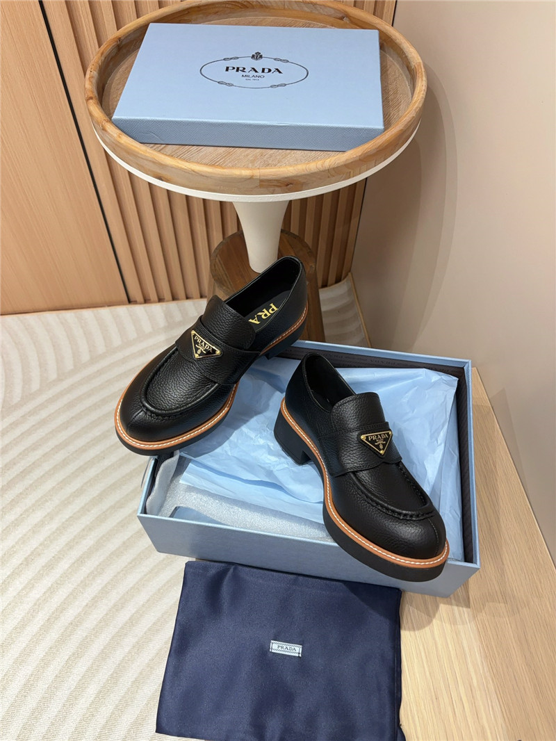 Pra*a black double chocolate leather loafers