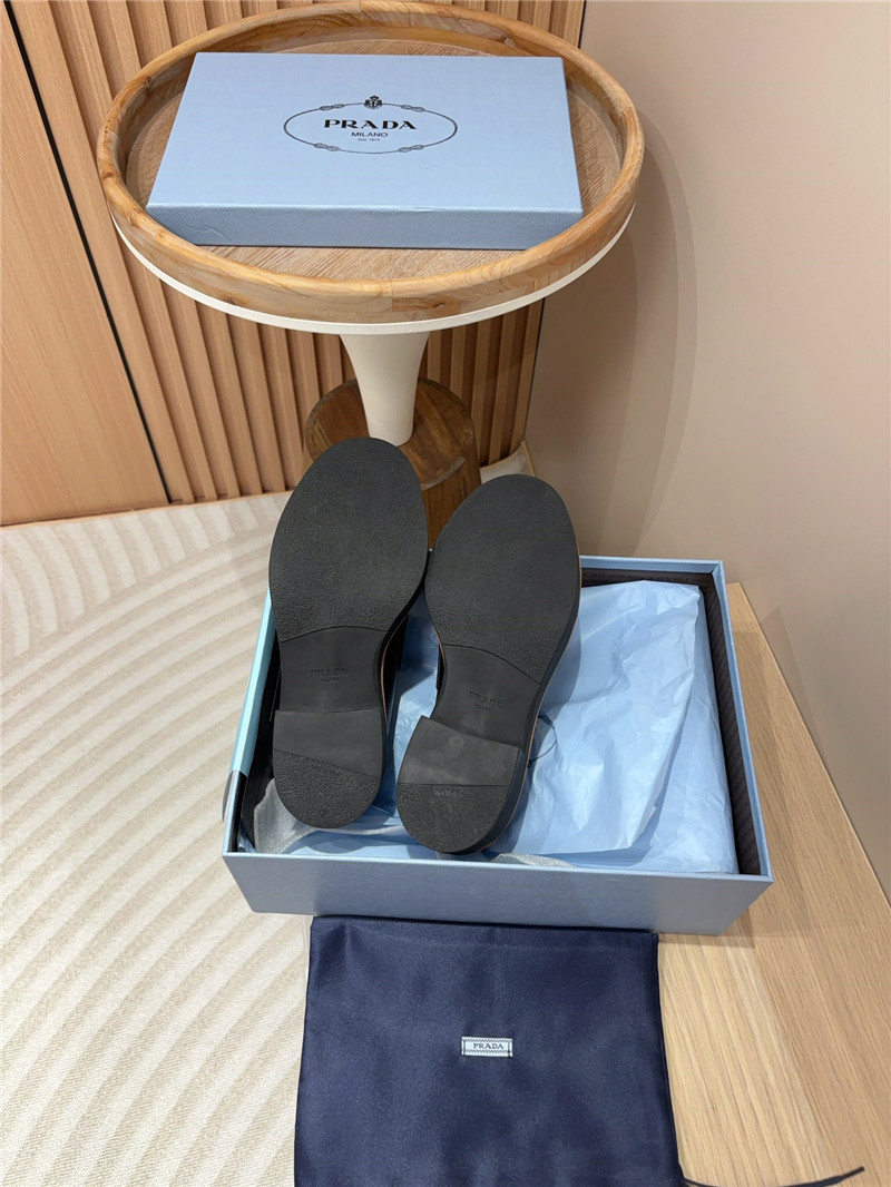 Pra*a black double chocolate leather loafers