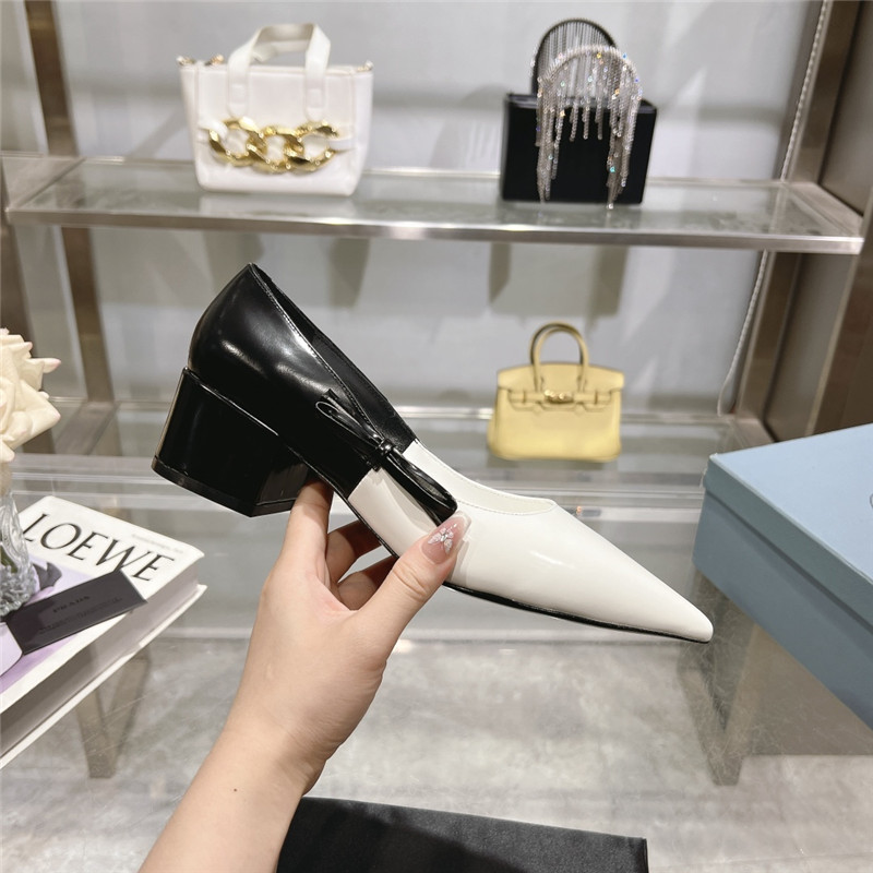 Pra*a chunky pointed pumps in black and white calfskin