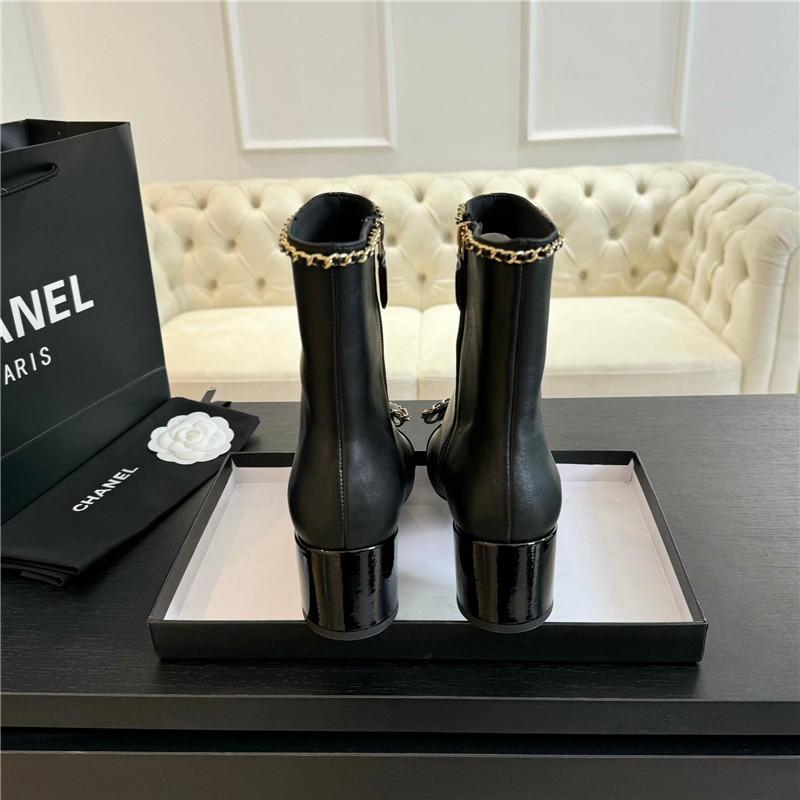 Ch**el black calfskin bow patent leather ankle boots