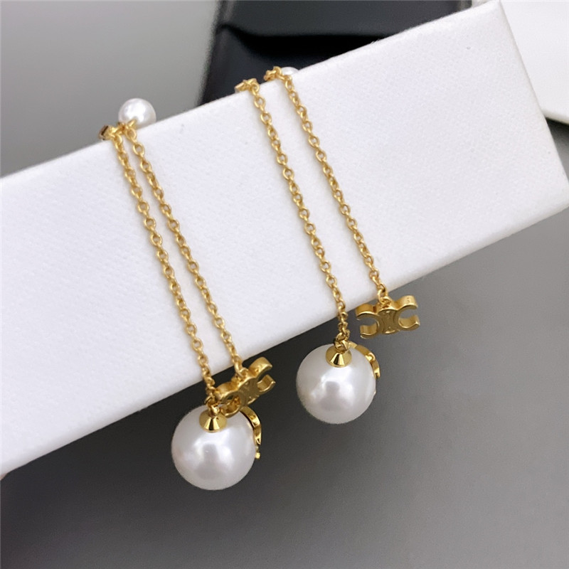 Ce1i*e double chain arc de triomphe hanging bead earrings