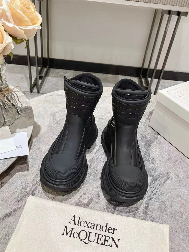 a1exa*der Mcqv*en black tread slick high top sneakers