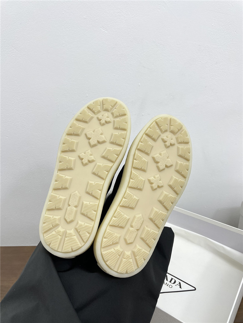 Pra*a triangle-logo platform black suede boots