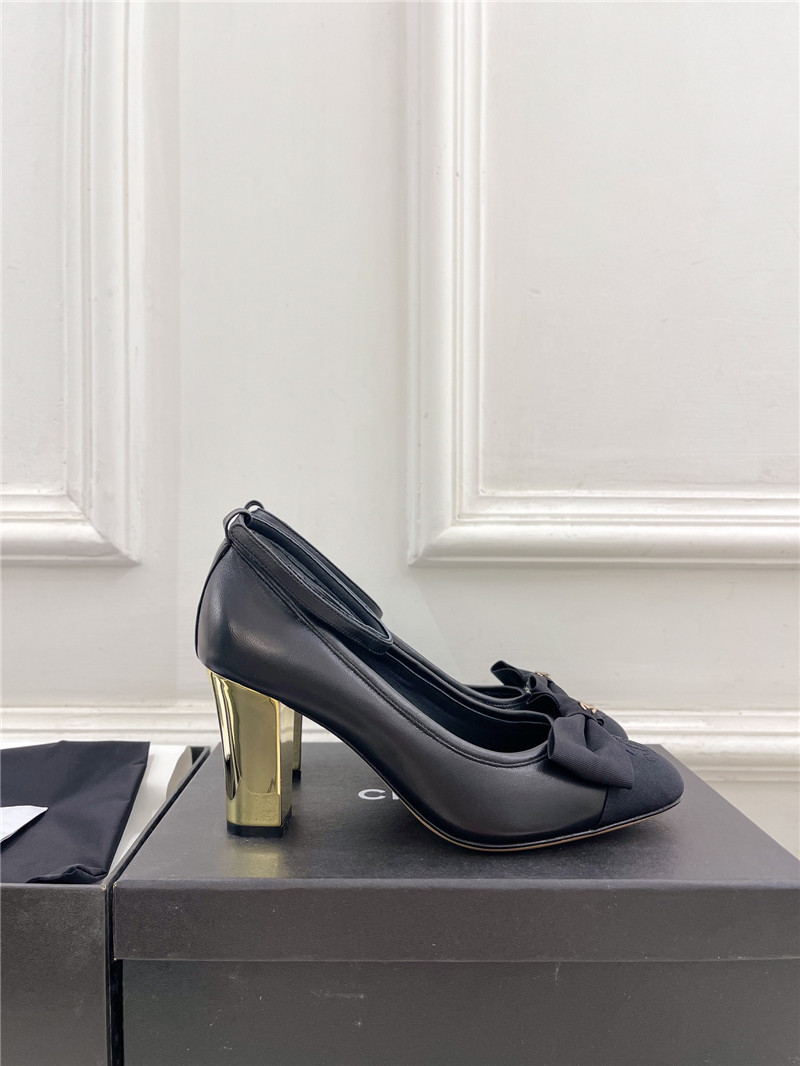 Ch**el bow mary jane heel pumps in black calfskin