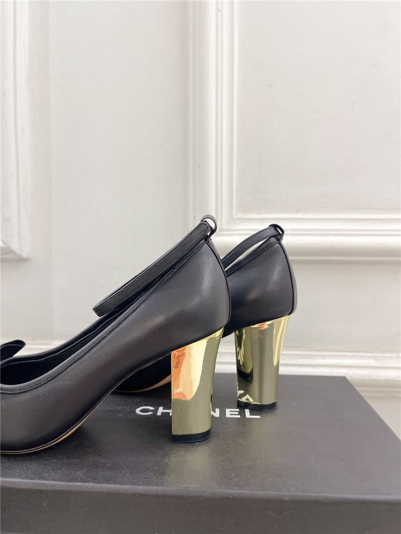 Ch**el bow mary jane heel pumps in black calfskin