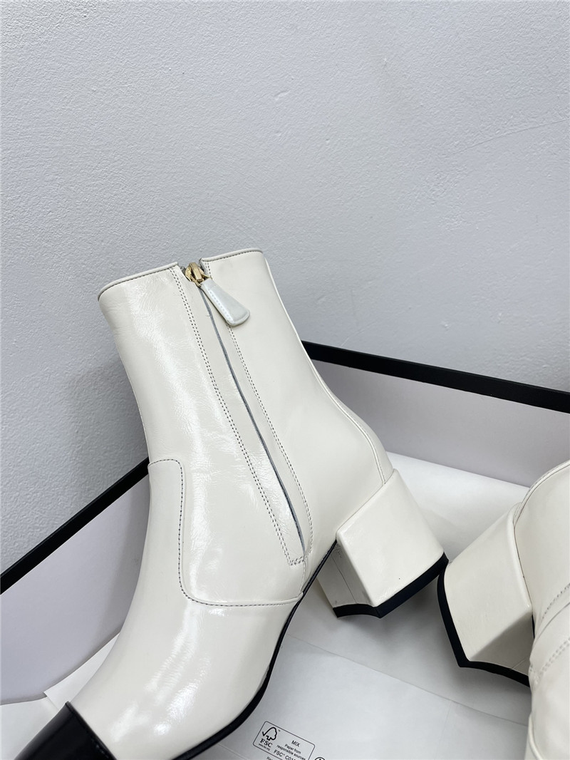 Ch**el calfskin block heel round toe ankle boots