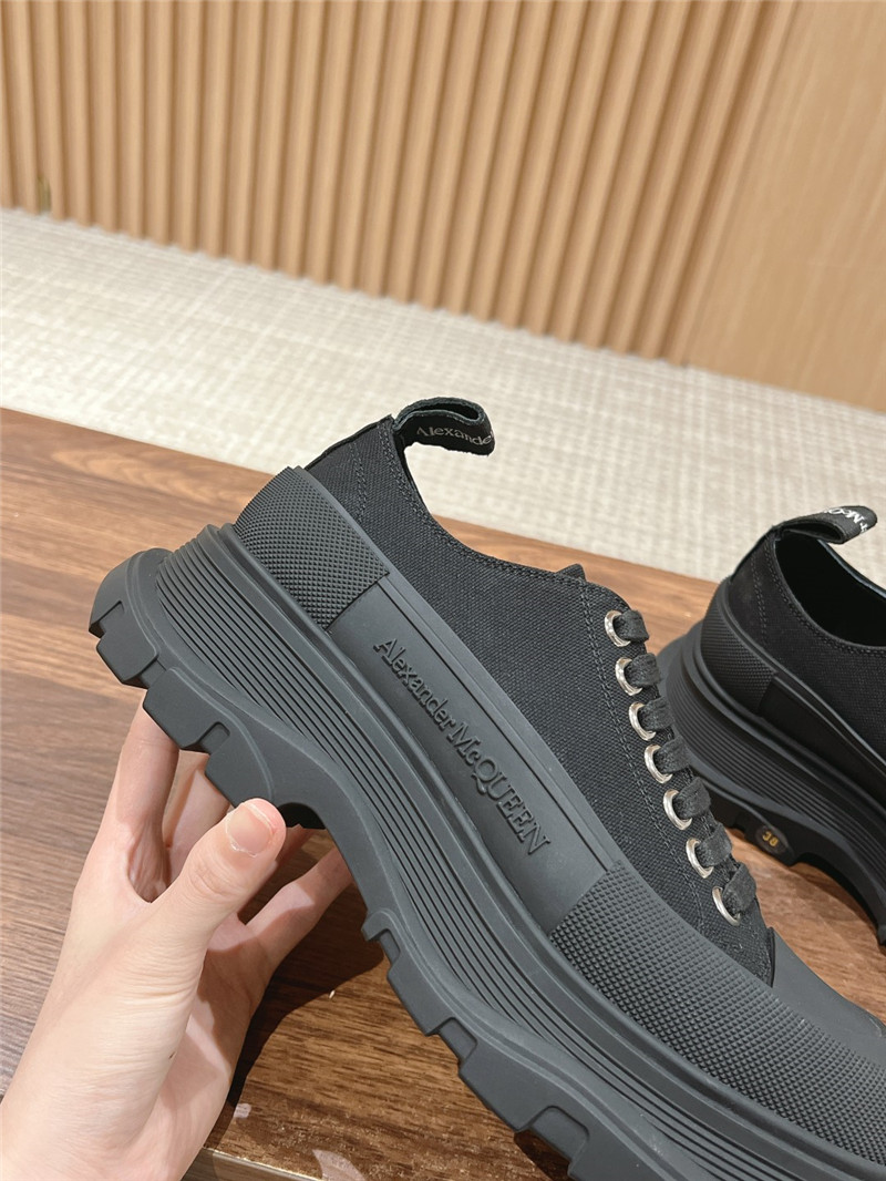 a1exa*der Mcqv*en black tread slick low top sneakers