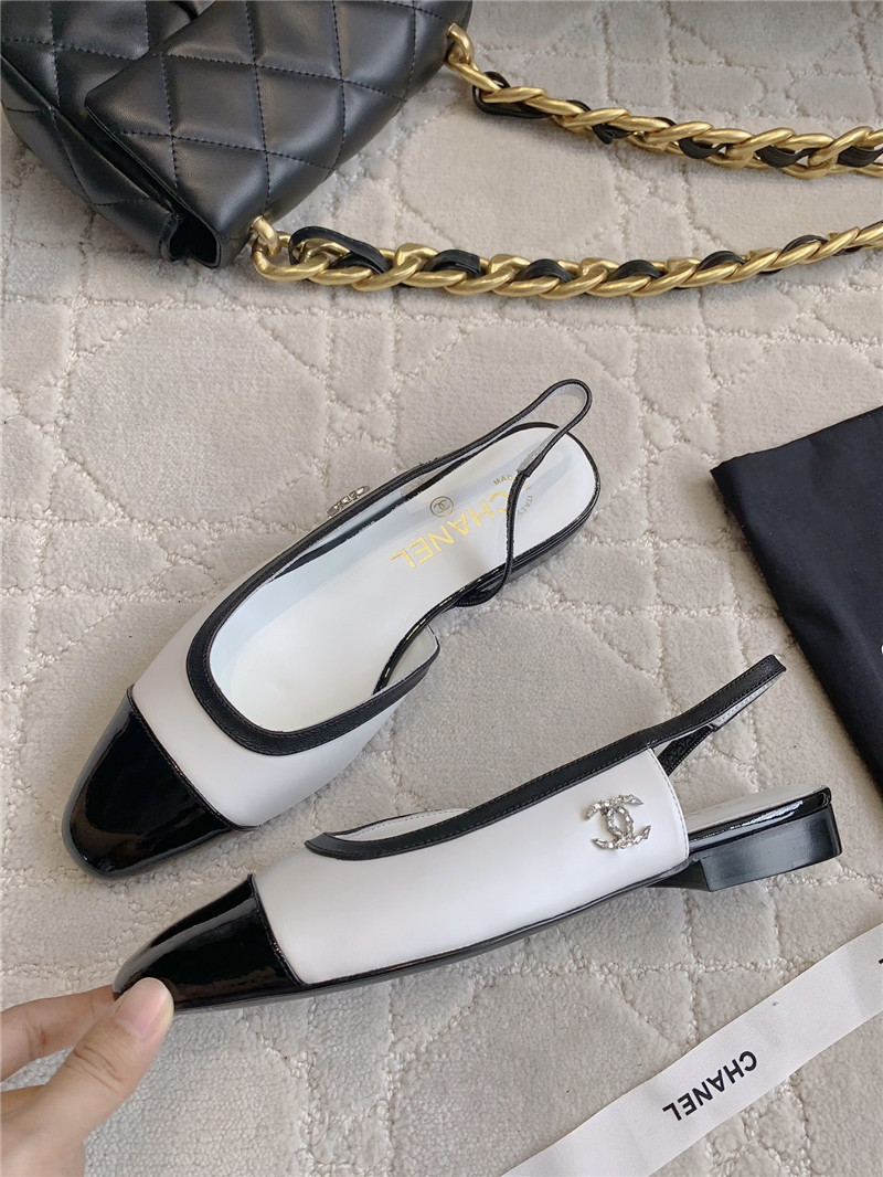 Ch**el pumps & slingbacks in white/black goatskin