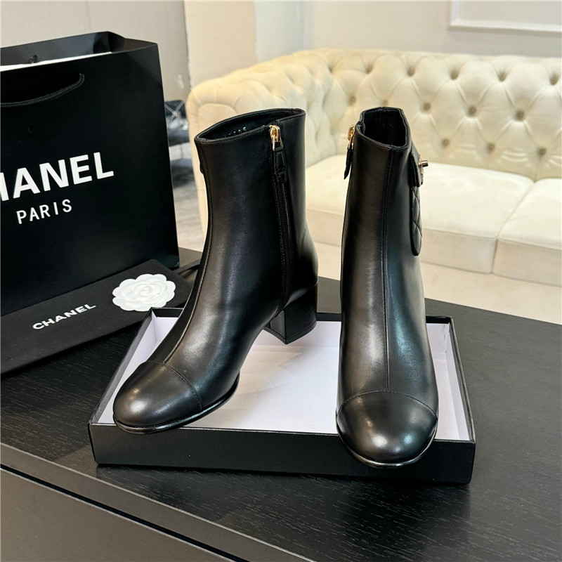 Ch**el black calfskin cap toe ankle boots