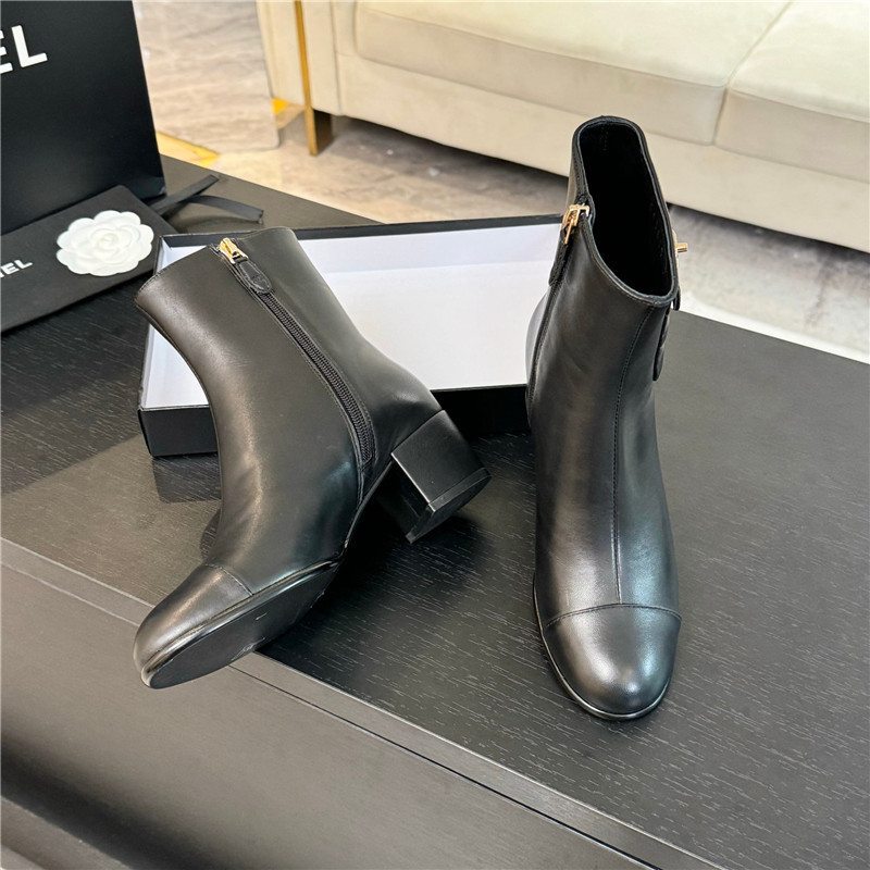 Ch**el black calfskin cap toe ankle boots