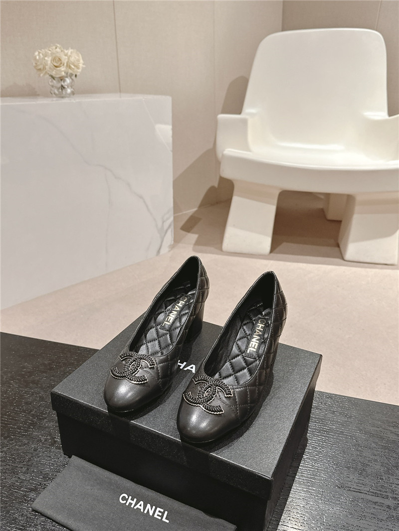 Ch**el black quilted leather cap toe pumps