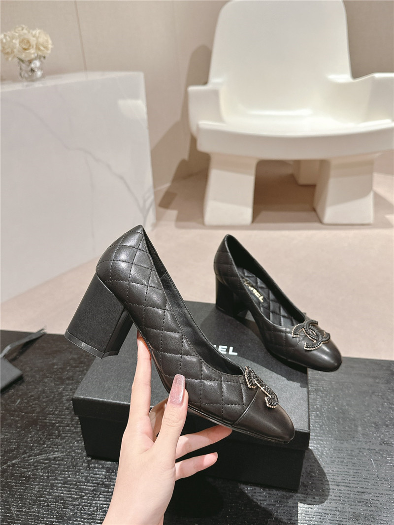 Ch**el black quilted leather cap toe pumps