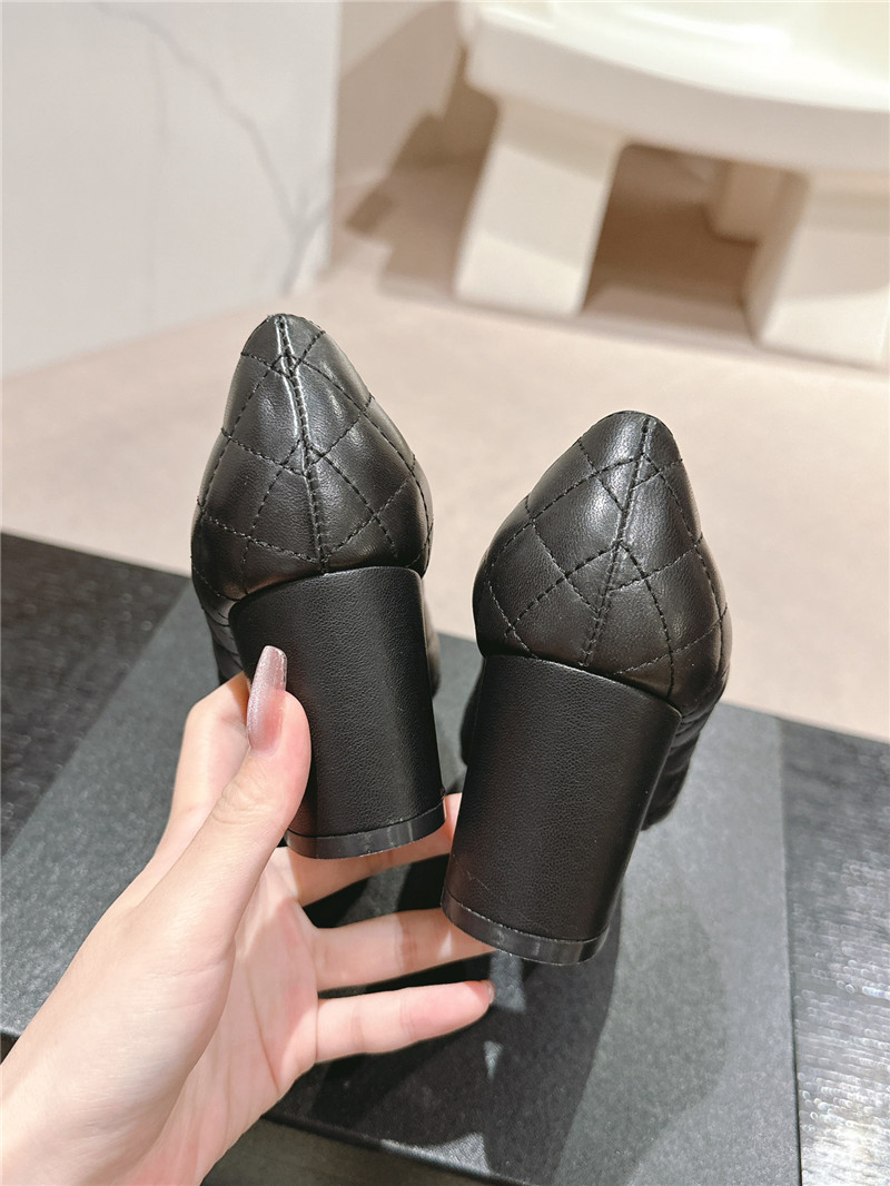 Ch**el black quilted leather cap toe pumps
