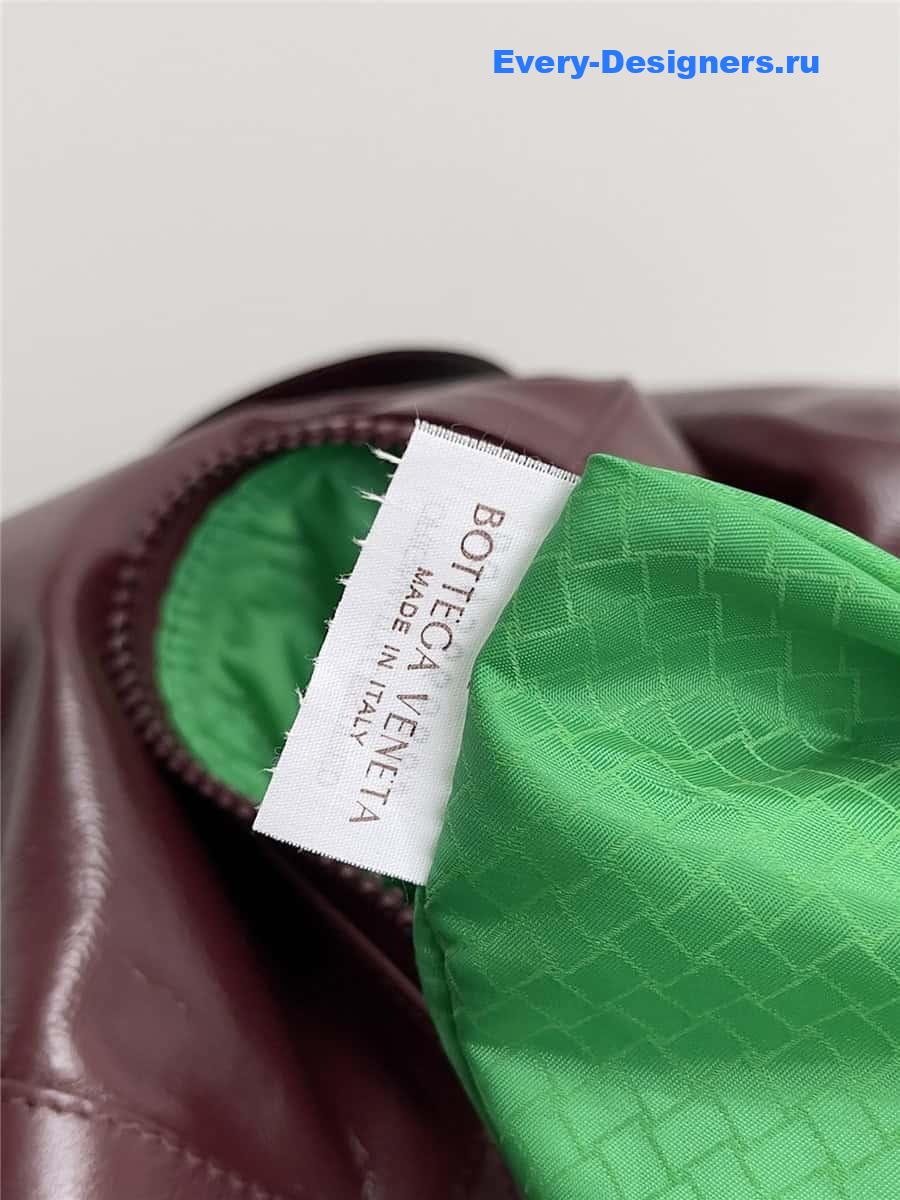 b0tt*ga Ven*ta wine red leather travel bag