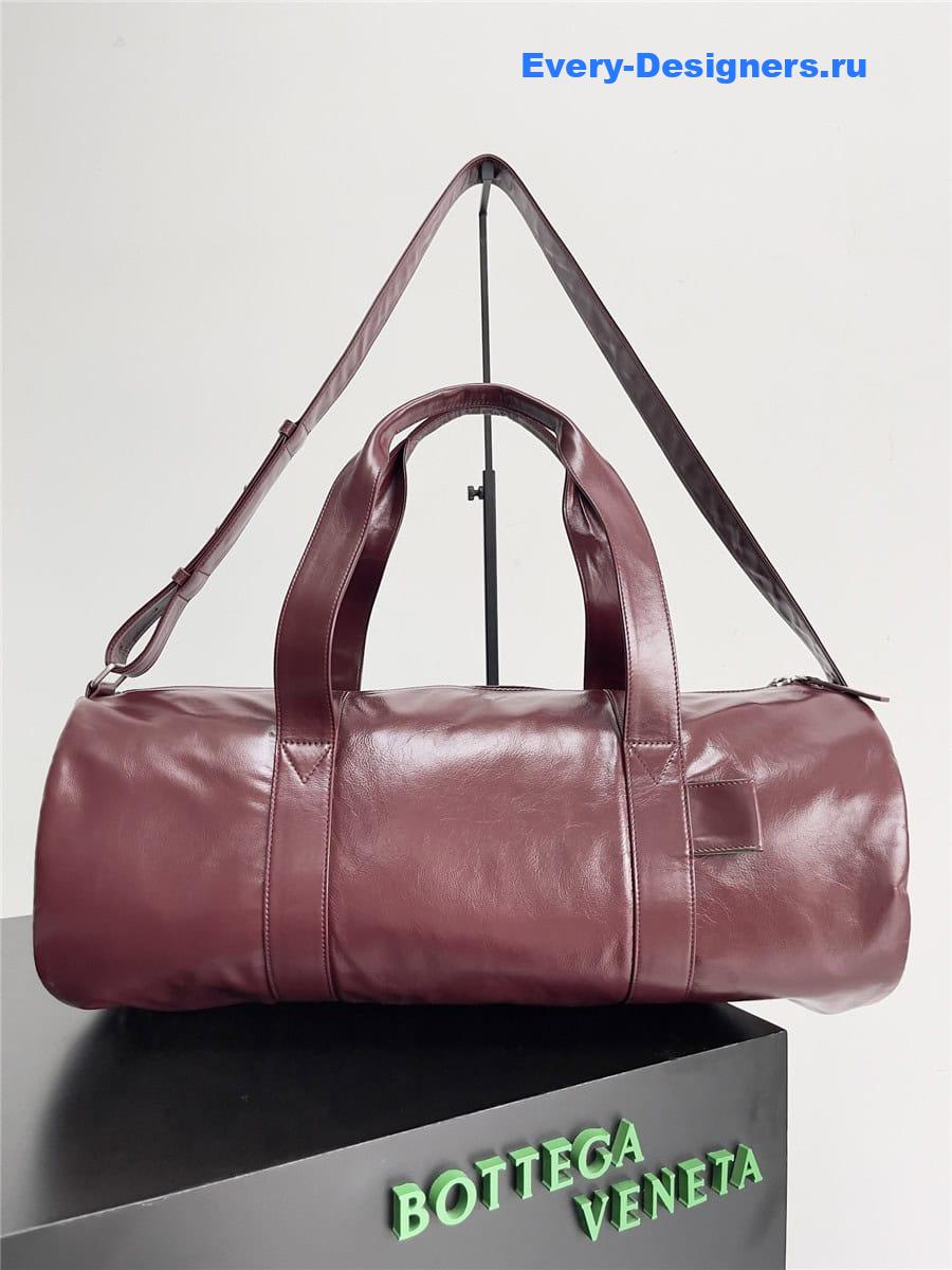 b0tt*ga Ven*ta wine red leather travel bag