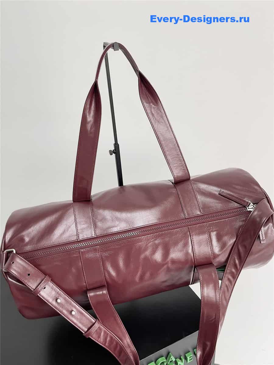 b0tt*ga Ven*ta wine red leather travel bag