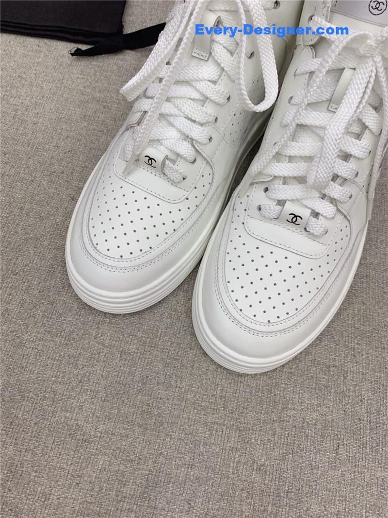 Ch**el white high-top sneakers