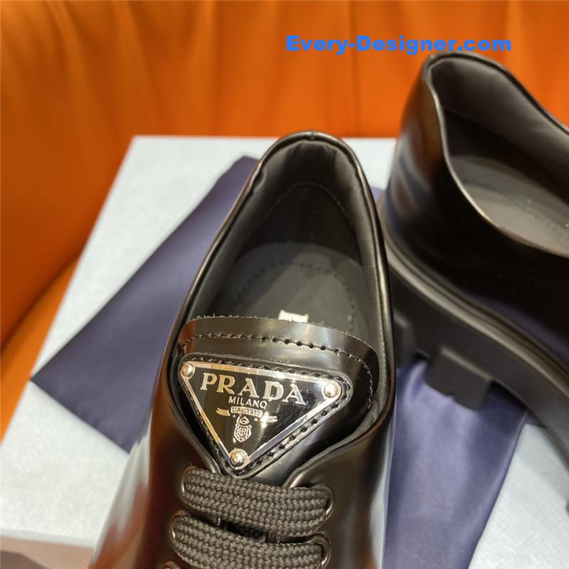 prada triangle logo lace-up loafers