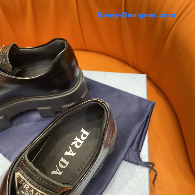 prada triangle logo lace-up loafers