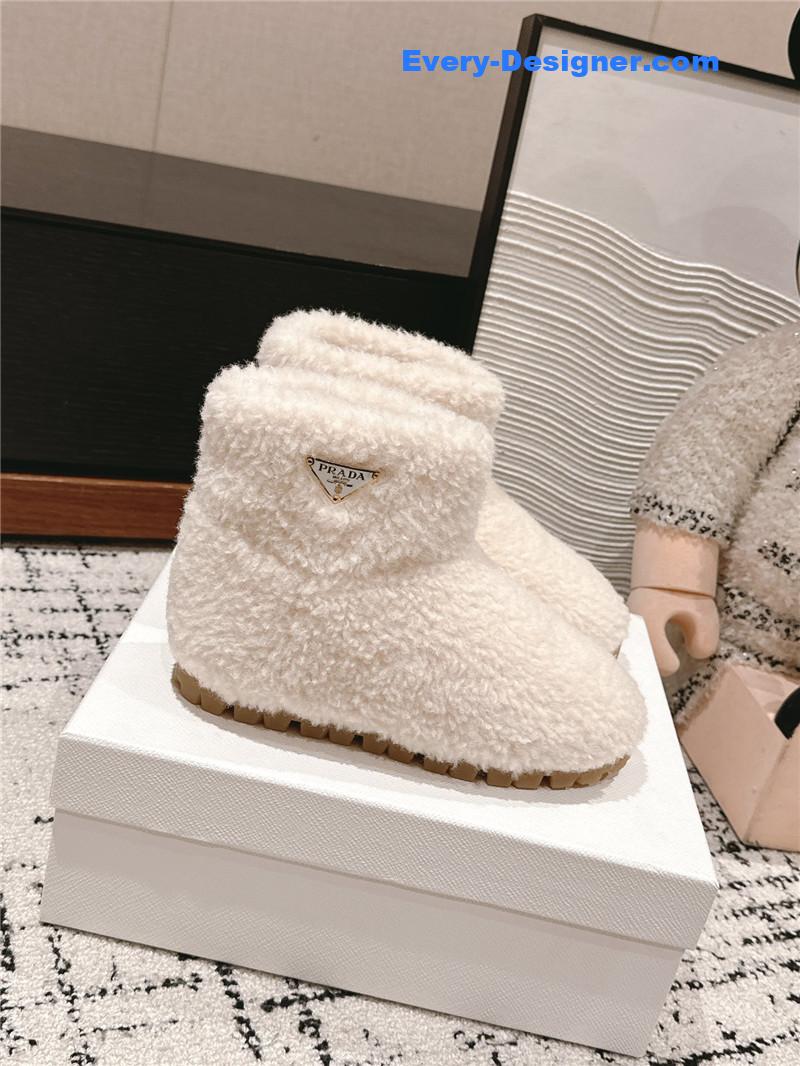 Pra*a white shearling booties
